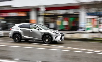 An image of a Toyota car driving down a road