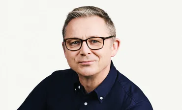Headshot of Adrian McDermott, CTO, Zendesk, wearing dark shirt