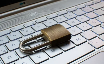 Internet security concept with padlock protecting computer