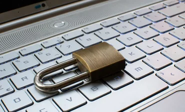 Internet security concept with padlock protecting computer