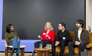 Panel discussion with customers - four people seated on stage - at Canva EMEA analyst day Feb 2026