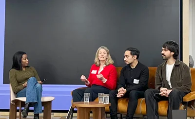 Panel discussion with customers - four people seated on stage - at Canva EMEA analyst day Feb 2026