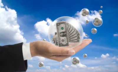 Business hand holds dollars in a bubble © suphakit73 - Fotolia.com