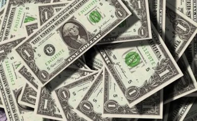 an image of a pile of dollar bills 