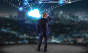 Businessman scratches head looking at cloud network © Production Perig - shutterstock