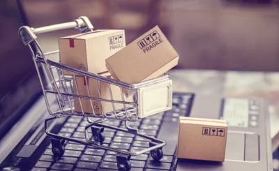 Boxes in a trolley on a laptop keyboard © William Potter - Shutterstock