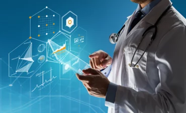 healthcare, people, technology and medicine concept - close up of doctor in white coat with stethoscope and tablet pc computer over blue background with charts © Syda Productions - Shutterstock