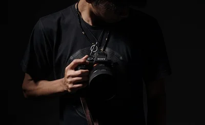 an image of someone holding a Sony camera