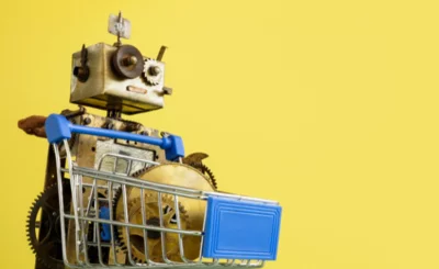 Robot with shopping cart and mechanical parts. AI tools concept with sales and promotion. © designer491 - Canva.com