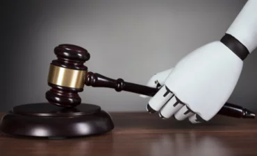 Robot's Hand Hitting Gavel At Desk © AndreyPopov - Canva.com